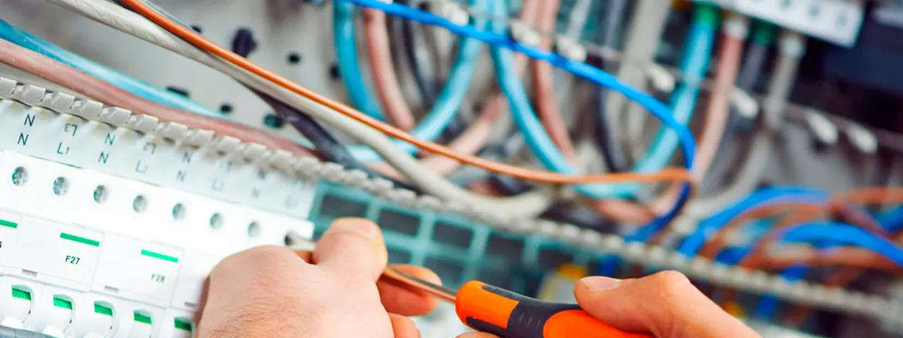 Network installer working on network equipment.