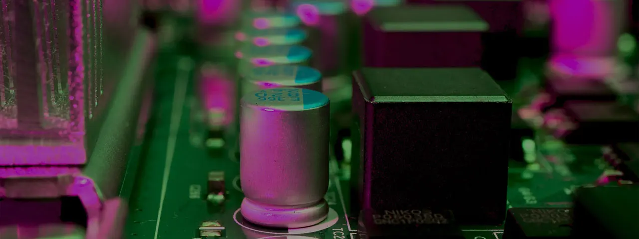 Showing capacitors on a mainboard inside a Bradenton computer picked up for repairs.