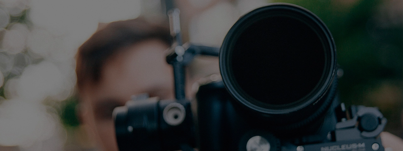 Professional videographer working outside at a corporate video company.